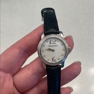 Tiffany & Co. Platinum and diamond watch. 
Mother of pearl dial